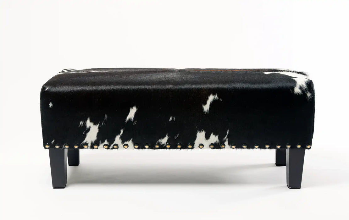 Cowhide Ottoman with Wood Legs and Studs 