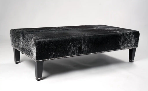 Dark grey salt n pepper speckle cowhide ottoman with decorative studs